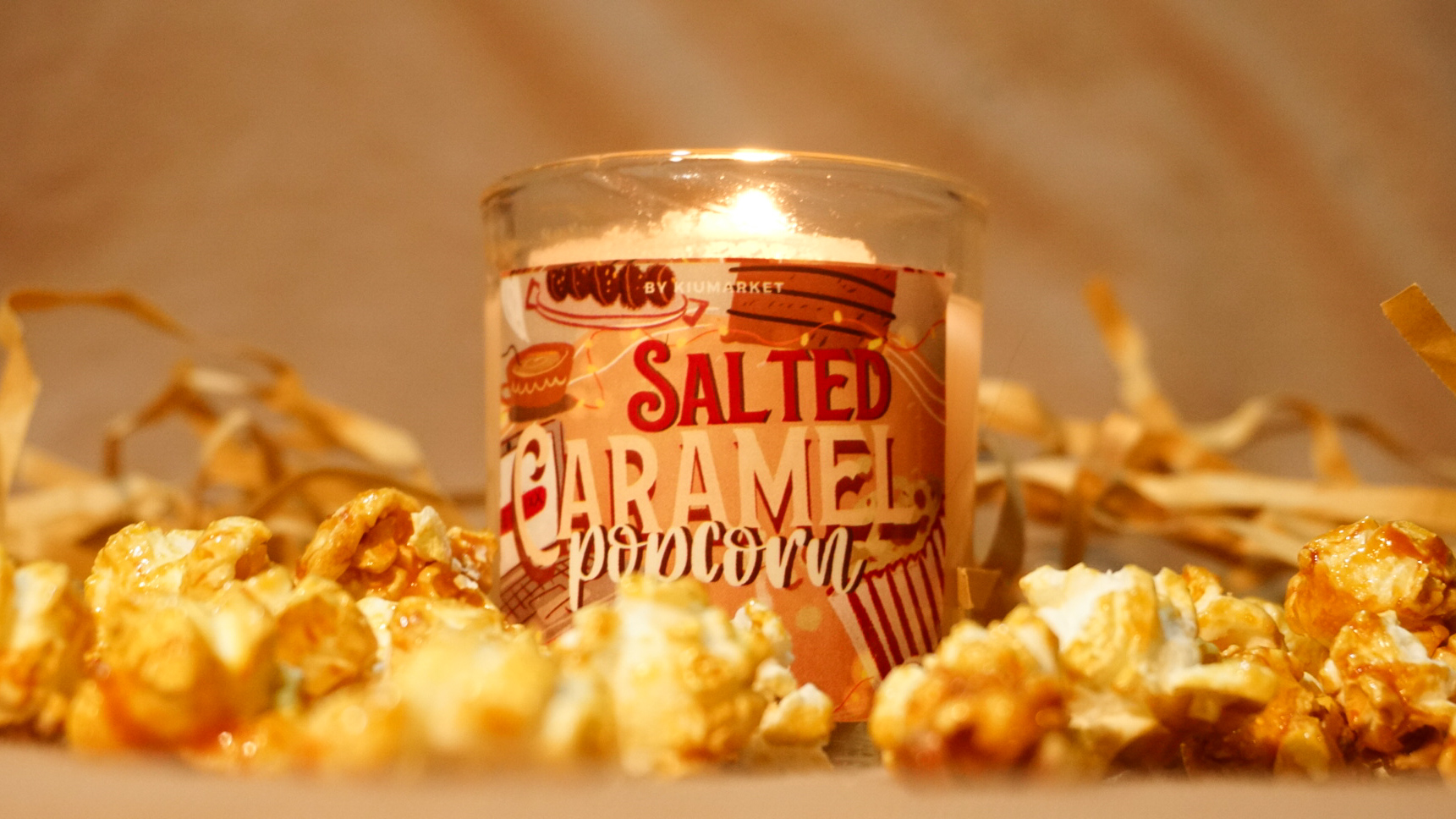 White candle with red berries